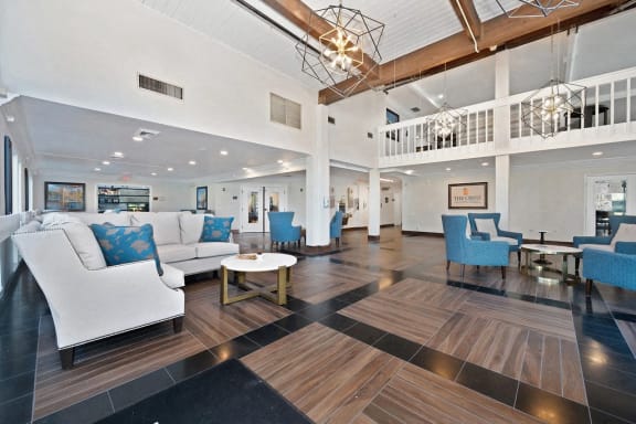 a resident clubhouse with couches chairs and a coffee table at Citrus Heights Apartments, Citrus Heights