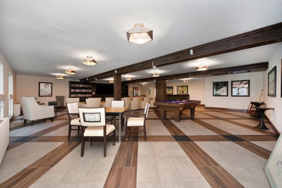 a recreation room with a pool table and chairs at The Crest at Citrus Heights Apartments, Citrus Heights, CA