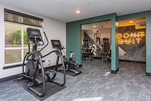 A gym with a neon sign that says "Don't Quit" at 128 on State, Kirkland, WA, 98033
