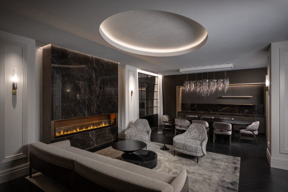 a living room with a couch and chairs and a fireplace  at The Belden Stratford, Chicago, IL, 60614