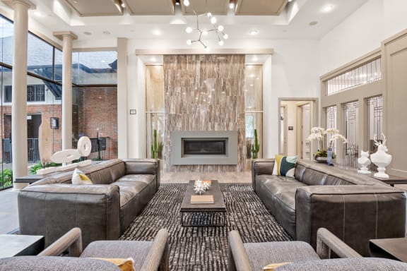 a living room with couches and a fireplace