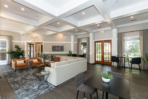 a living room with a couch and a table at Deerfield Village, Alpharetta