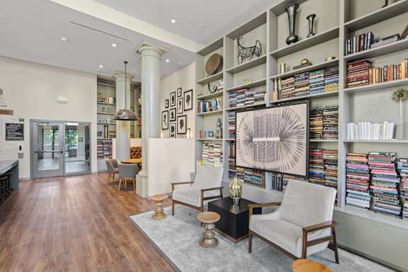 a living room with a bookshelf full of books