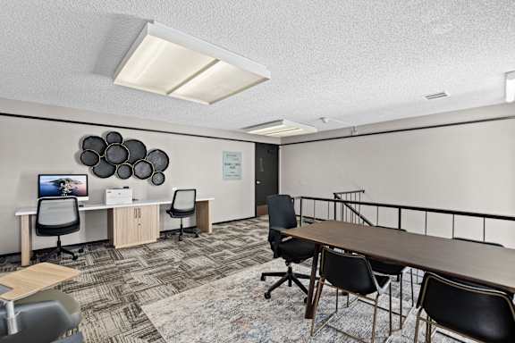 A conference room with a long table and chairs at Delphine on Diamond, San Francisco, CA 94131