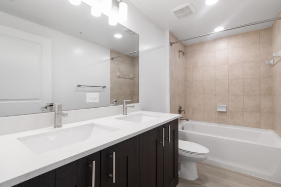 a bathroom with a sink and a toilet and a shower at One Plantation in Plantation, FL