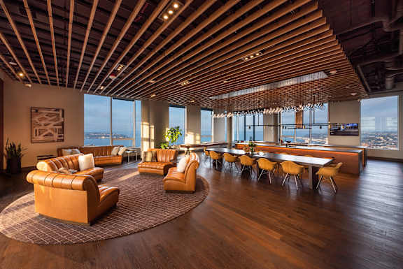 A modern living room with wooden floors and furniture.