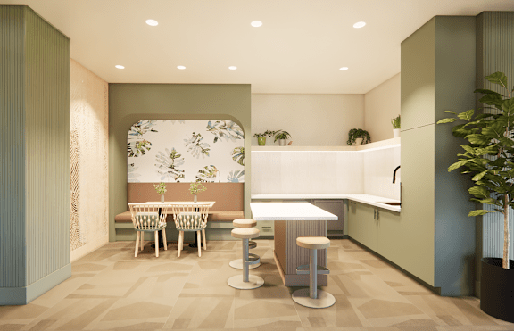 A room with a table and chairs in front of a wallpapered wall.