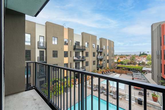 Balcony with a pool view at Misora Apartments, California, 95128