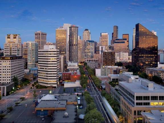 A cityscape with tall buildings and a clear sky at Skye at Belltown Apartments, Seattle