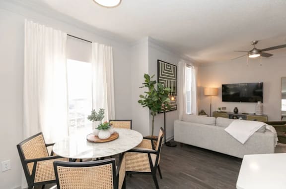 A living room with a dining table and chairs at Deerfield Village, Alpharetta, Georgia, 30004