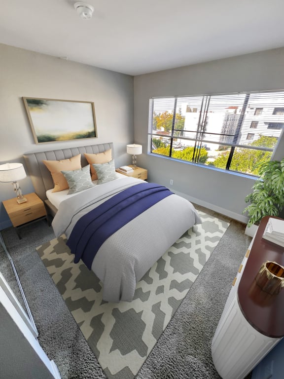 a bedroom with a bed and a large window  at Duet on Wilcox, Los Angeles