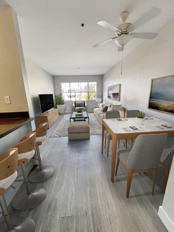 a living room and dining room in an apartment  at Duet on Wilcox, Los Angeles, California