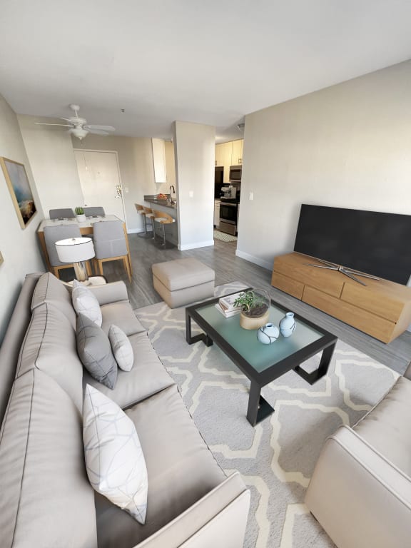 a living room with a couch and a table  at Duet on Wilcox, Los Angeles