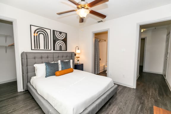 a bedroom with a large bed and a ceiling fan at Briarcliff Apartments, Atlanta, GA, 30329