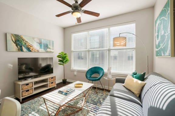 a living room with a couch and a ceiling fan at Mockingbird Flats, Texas, 75206