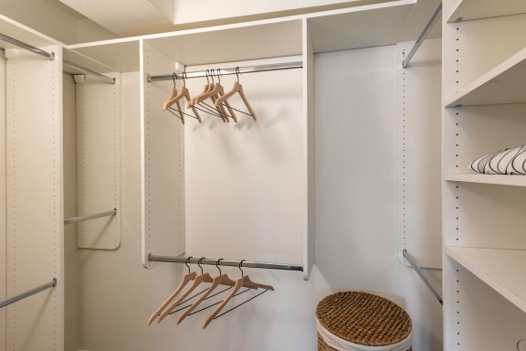 a walk in closet with hooks and a white wall at The Rays at Vegas Towers Apartments, Las Vegas, Nevada