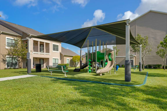our apartments have a playground with a variety of play equipment