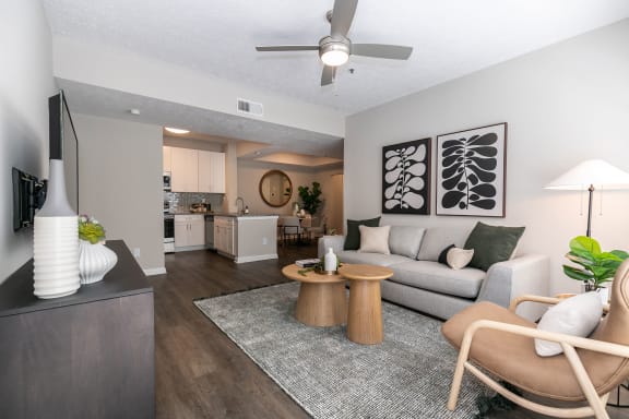an open living room and kitchen with a couch and a table at Willowest in Vinings, Atlanta, GA