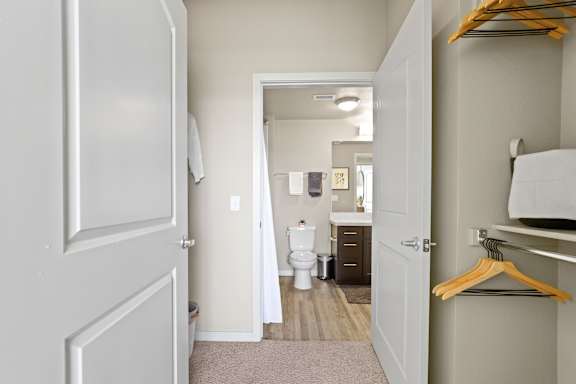 a room with a closet and a toilet and a bathroom at Ridge at Thornton Station Apartments, Thornton, CO 80229