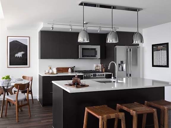A modern kitchen with a black and white color scheme.