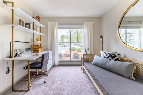 a bedroom with a bed and a desk and a window at Ashford Green, Charlotte, NC
