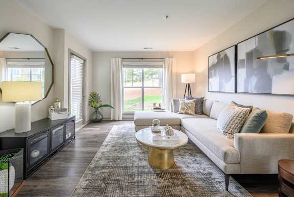a living room with a couch and a coffee tableat Ashford Green, Charlotte, 28262