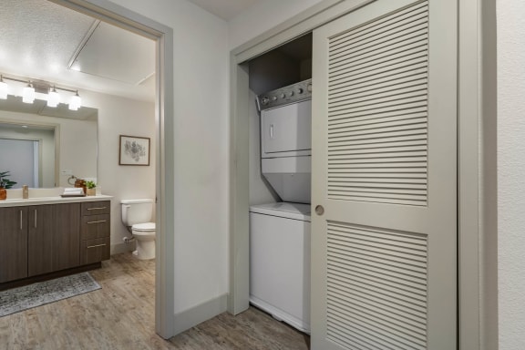 a laundry room with a closet and a toilet and a sink at Aventine, Hercules, CA, 94547