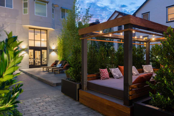 a patio with a couch and a canopy at Aventine, California