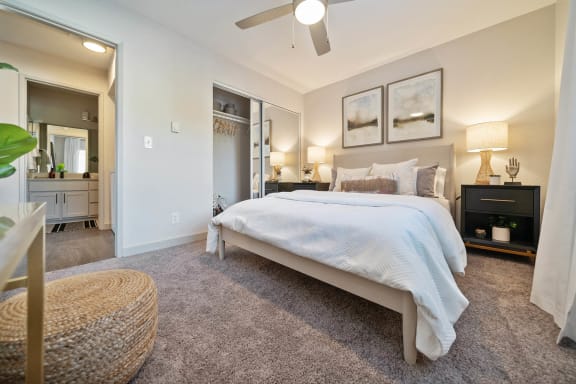a bedroom with a bed and a ceiling fan at Bay Village, Vallejo, California