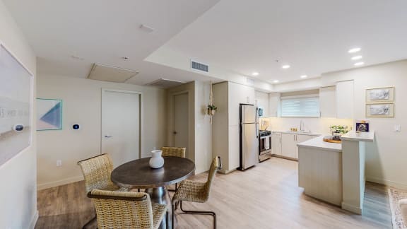 a kitchen and dining room with a table and chairs at Chase Knolls, Sherman Oaks, CA, 91423