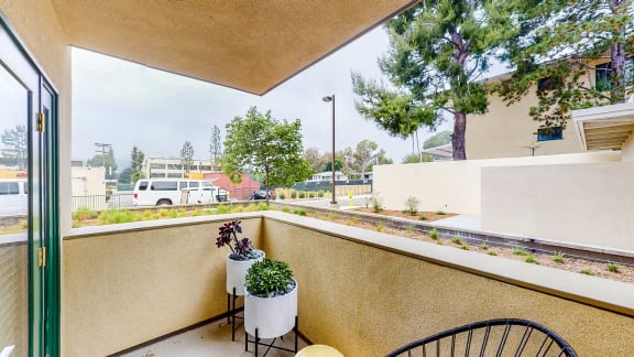 a balcony with a view of a street and trees at Chase Knolls, Sherman Oaks, California