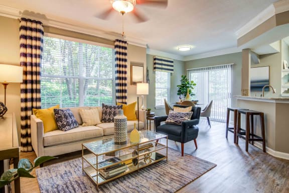 a living room with a couch and a table at Deerfield Village, Alpharetta, GA