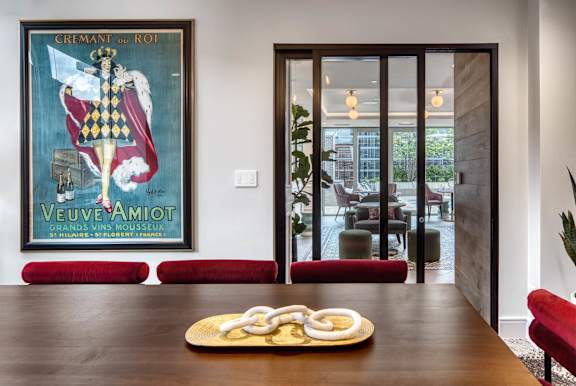 poster of a king is hanging on wall at Flair Tower Apartments, Chicago