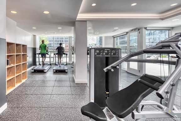 gym with a treadmill at Flair Tower Apartments, Chicago
