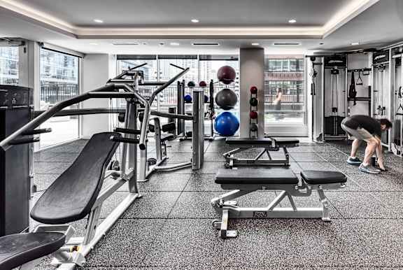 gym with a variety of equipment at Flair Tower Apartments, Chicago Illinois