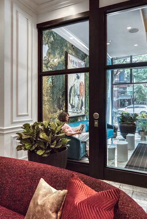 red couch door in background at Flair Tower Apartments, Chicago, IL 60654
