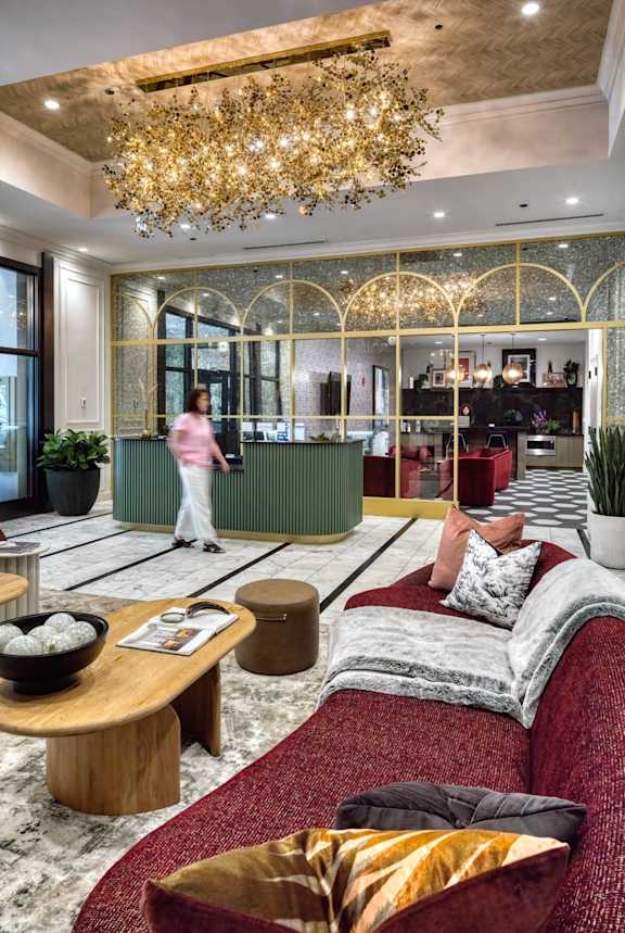 large golden chandelier in a room at Flair Tower Apartments, Chicago
