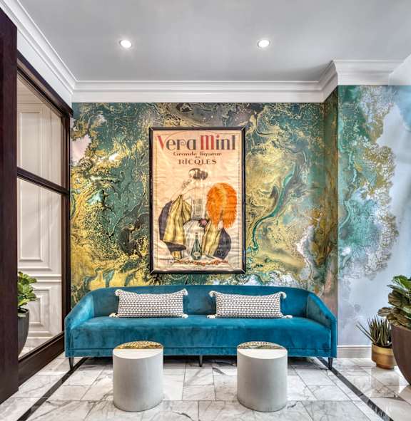 living room with a blue couch at Flair Tower Apartments, Chicago Illinois
