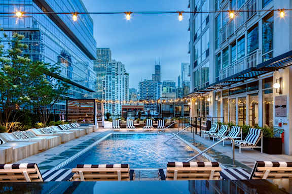 rooftop pool skyline in the background at Flair Tower Apartments, Chicago