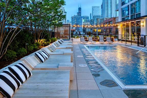 pool area with lounge at Flair Tower Apartments, Chicago, 60654