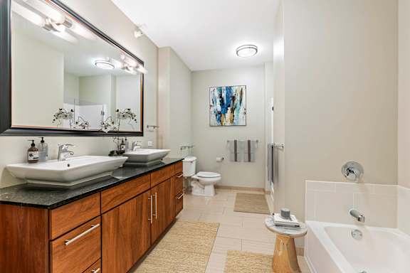 Bathtub in bathroom at Flair Tower Apartments, Chicago