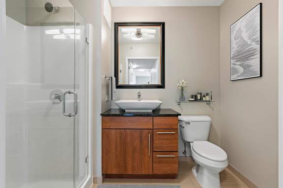 bathroom with a white toilet at Flair Tower Apartments, Chicago, IL