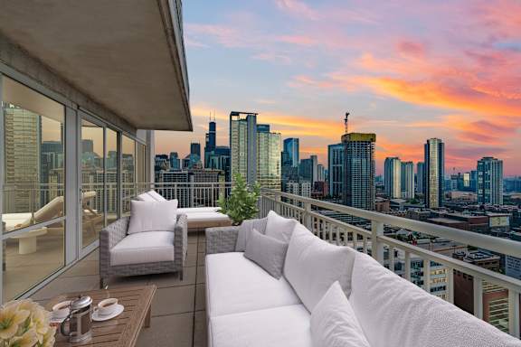 balcony with white cushions at Flair Tower Apartments, Illinois