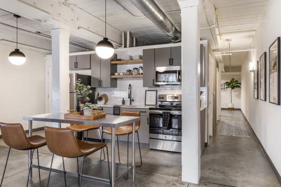 a kitchen and dining area in a loft at Highland Mill Lofts, Charlotte, North Carolina