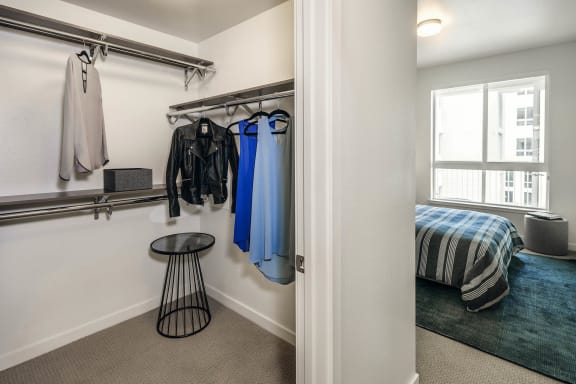 a closet in a bedroom with a bed and a window at Delphine on Diamond, California, 94131