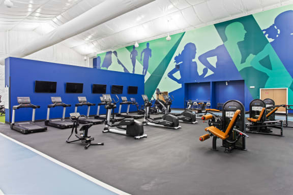 the gym is equipped with cardio machines and weights at The Annaline, Nashville, TN