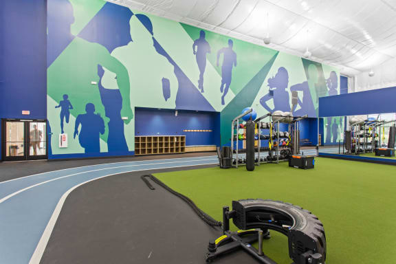 a workout room with a treadmill and other equipment at The Annaline, Nashville, TN, 37217