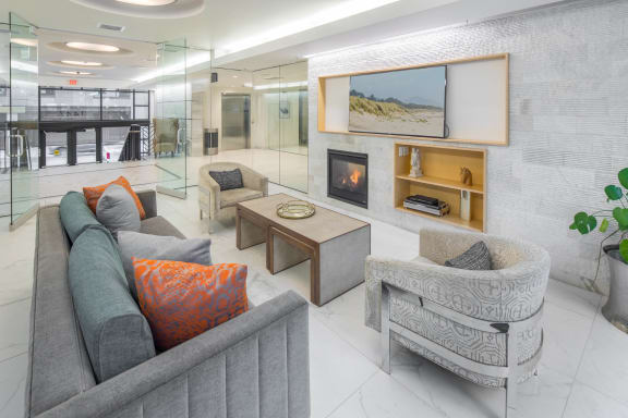 a living room filled with furniture and a fireplace at The Parker Apartments, Portland