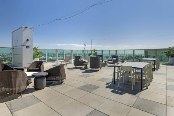 the rooftop terrace of the building has tables and chairs at Vue, San Pedro, CA