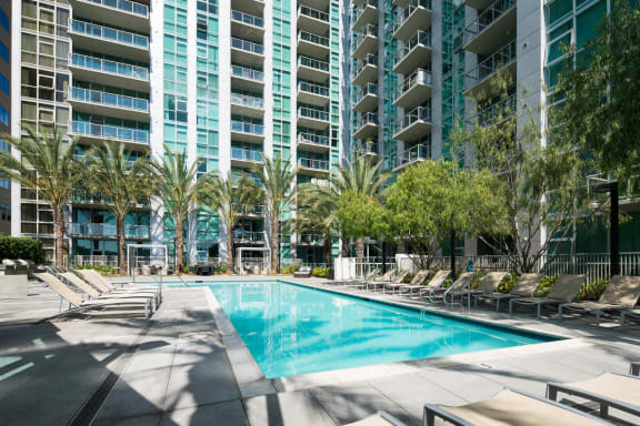 a large swimming pool in front of an apartment building at Vue, San Pedro, CA